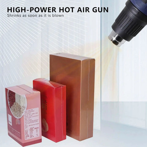 Heavy Duty Shrink Wrap Sealer Machine, 450W To 800W Heat Fuser creating shrink-wrapped packaging with hot air gun.
