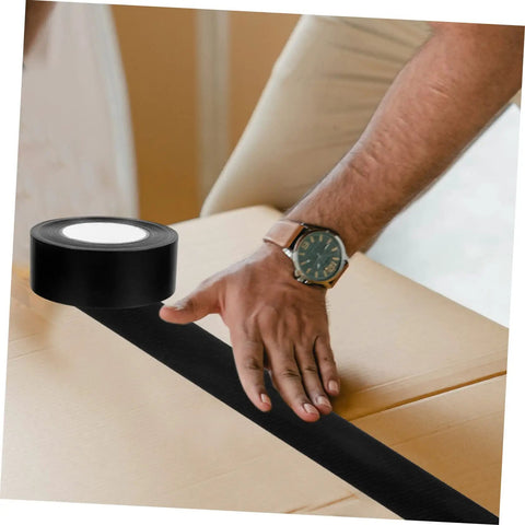 Heavy Duty Leak Stop Tape Outdoor Sealing Tape Double Sided Waterproof For Water Pipes Extra Wide Patch Kit being applied on a box