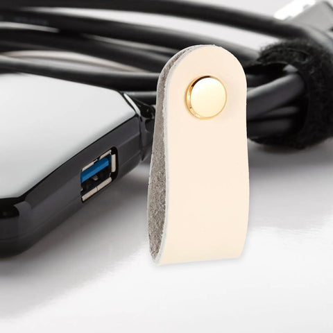 Slick Double Pack PU Leather Cord Organizer Ties For Reusable USB Charger Straps And Earphone Holders, beige leather strap close-up.