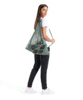Mesh Pool Gear Sack For Swim Team Practice Quick Dry Tote Bag with Drawstring Closure worn by woman, Sage Green color.