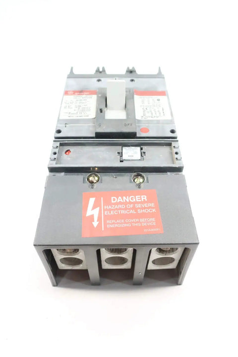 Pro Grade Heavy Duty Three Pole Six Hundred Amp Circuit Breaker Featuring Spectra Rms Series Build with danger label and terminals visible.