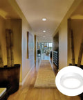 Slick 4 Inch Led Ceiling Light Low Profile Surface Mount Downlight Wet Rated Matte White Trim illuminates hallway.