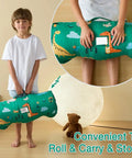 Child holding Rollup Toddler Nap Mat With Removable Pillow And Minky Blanket Dinosaur Themed Sleeping Bag For Daycare Preschool Travel