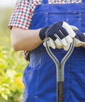 Gardener holding D Grip Shovel Handle Replacement With 32mm Inner Diameter Metal Core And Wooden Grip in blue overalls.