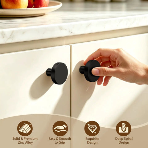 Top Tier Heavy Duty Black Cabinet Knobs Slick Round Handles For Kitchen Cupboards And Drawers Solid Zinc Alloy Hardware Built Tough Quick Install Hassle Free Setup Dependable Twenty Pack Bundle. Hand reaching for a smooth black zinc alloy cabinet knob on kitchen cupboard.