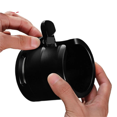 Boss Level 58Mm Espresso Tamping Station With Slick Anti Slip Base And Quick Adjustable Frame For Hassle Free Coffee Tamping Plus Nifty Grounds Catch Tray, showing black tamper holder with hands adjusting.