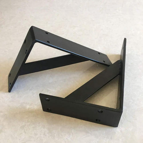 Heavy Duty Wall Mounted Shelf Brackets With Bullet Proof Triangular Steel Frame For Countertops And Floating Shelves Rust Resistant Matte Black Finish, angled view on light surface.