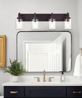 Oil Rubbed Bronze Three Light Vanity Fixture With Rustic Wall Sconces And Clear Glass Shades above a bathroom mirror