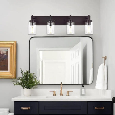Oil Rubbed Bronze Three Light Vanity Fixture With Rustic Wall Sconces And Clear Glass Shades above a bathroom mirror