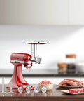 Red metal meat grinder attachment for KitchenAid stand mixer; includes 4 grinding plates, 3 sausage tubes, 2 blades.