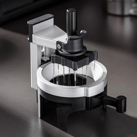 Premium 58 Millimeter Espresso Puck Distributor With Adjustable Height Rotary Pointer showing twelve needle spinner for even extraction.