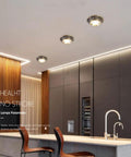 Ten Pack Brushed Brass Led Downlights 10 Watt Dimmable Eyeball Spotlights No Fuss Recessed Lighting Kit installed in modern kitchen.