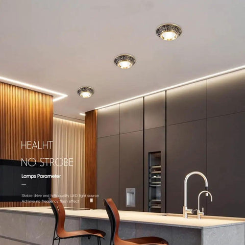 Ten Pack Brushed Brass Led Downlights Featuring Dimmable Eyeball Retrofit Spotlights With No Sweat Drop In Install And A Clean Warm Glow hanging from a ceiling.