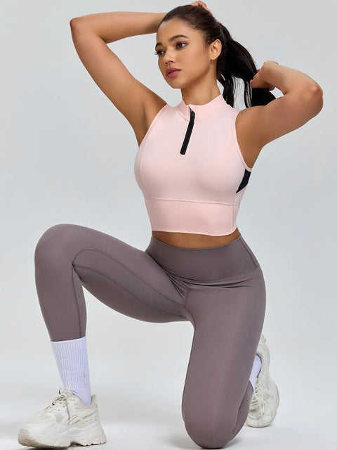 Model wearing Cropped Workout Tank For Women With Built In Bra Half Zip High Neck Sports Top with Chintz Rose color, kneeling pose