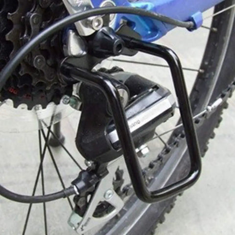 Close-up of bike with universal rear derailleur guard rack protector, heavy-duty steel shield, easy bolt-on or quick-release install.