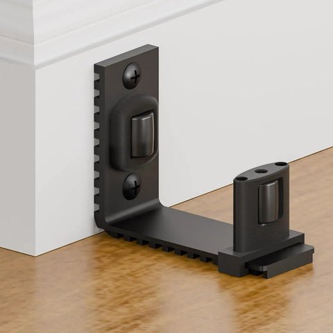 Adjustable Sliding Barn Door Floor Guide With Rock Solid Heavy Duty Metal Base And Double Nylon Quiet Rollers For A Smooth As Butter Glide On Any Interior Door Frame In Sleek Black close-up view mounted on floor.