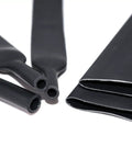 Close-up of Dope Heat Shrink Tubing Kit 127 Pcs with 2 to 1 Shrink Ratio, showing various black sizes for electrical insulation.