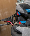 Close-up of hands using Beefy Heavy Duty Wire Stripper And Cutter For 6 To 12 AWG Stranded and 20 To 30 Solid plus 22 To 32 Stranded.