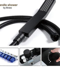 Easy Peasy Installation On This Wall Mounted Shower System Featuring High Pressure Rainfall Head And Sturdy Handheld Sprayer Paired With Slick Matte Black Fixtures For Instant Bathroom Glow Up - close-up of matte black handheld sprayer with flexible hose