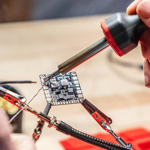 Soldering circuit board with 5 To 30 Watt Precision Soldering Iron Station With Adjustable Wattage And Integrated Safety Rest In Compact 120V Design