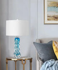 Dope Blue Glass Desk Lamp, 26 Inch Tall With Handcrafted Spiral Body on side table in living room setting