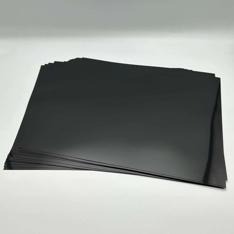 Stack of black opaque PET stencil sheets, 12x12 inches, 7.5 mil, for Cricut and laser cutting
