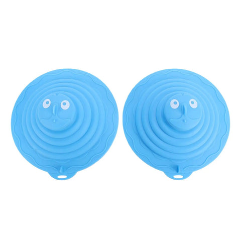 Two blue SUNGOOYUE Silicone Tub Stoppers with playful faces, round design, made from durable silicone material.