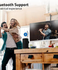 Couple enjoying music in room with 27 Inch Smart Monitor With WebOS For Streaming TV And Gaming Bluetooth Wireless Projection Screen Mirroring IoT Hub For Smart Home Height Adjustable Stand With Swivel Tilt And Pivot Dual 3W Speakers sRGB 99 Percent.