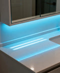 Blue glow from Battery Powered LED Strip Lights With 24 Key Remote for accent lighting under bathroom mirror cabinet