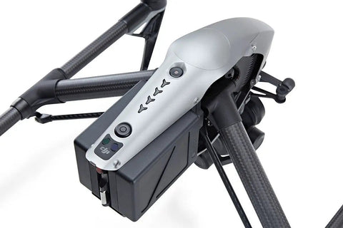 Close-up of Inspire 2 Drone Refurbished For Pro Filmmaking With Sense And Avoid, featuring dual battery setup and durable construction.