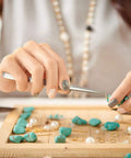 Woman using tweezers from All In One Jewelry Repair Kit With 1200 Jump Rings And Lobster Clasps, Pliers, Tweezers, And Opener
