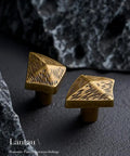 Antique Bronze Cabinet Knobs And Drawer Pulls Two Pack With Boho Geometric Silhouettes on dark surface with textured design