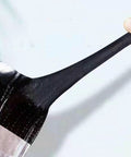 Heavy Duty Asphalt Roofing Tape That Kicks Leaks To The Curb With Heat Reflective Aluminum Foil showing flexible black adhesive strip close-up.