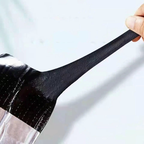 Heavy Duty Asphalt Roofing Tape That Kicks Leaks To The Curb With Heat Reflective Aluminum Foil showing flexible black adhesive strip close-up.