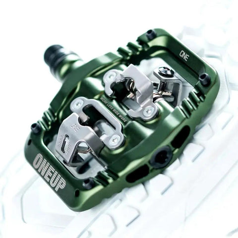 Ultra Thin Mountain Bike Clip Pedals Orange With Extra Large DH Sized Platform 26.8mm Profile For Maximum Grip And Fewer Pedal Strikes Lightweight Bombproof Clip In Pedals, close-up view showing metal clips and platform design.