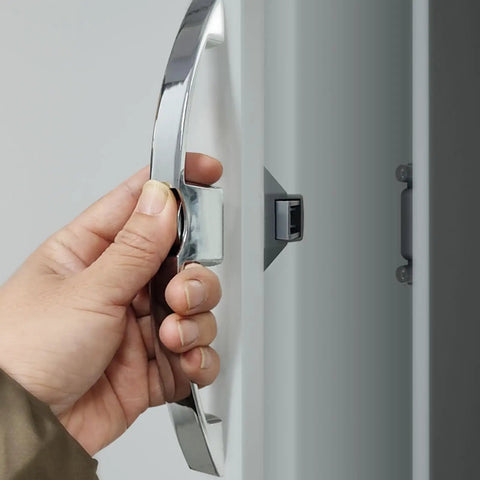 Hand holding Easy Grip Cabinet Door Latches And Pull Handles For Home Office And Locker Use Durable Push Button Closures Hardware Assorted