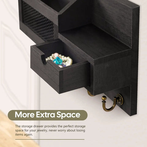 Side view of a key and mail organizer wall mount with six hooks and a small storage drawer open, showing jewelry stored inside.
