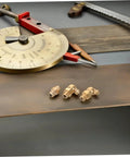 9 Piece Grease Fitting Kit With Copper Nozzle Caps For Cars And Trailers displayed with straight and angled nipples in a workshop setting