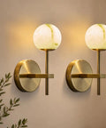 10 in Alabaster Wall Sconces Set of Two, Natural Marble Globe Wall Light, Modern Gold Wall Lamp for Living Room on wall.