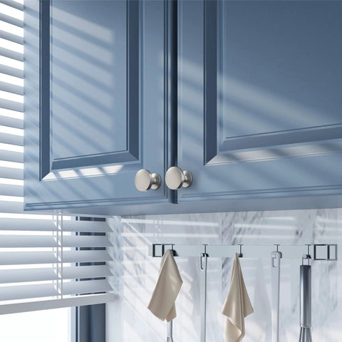 Installed 10 Pack Brushed Satin Nickel Cabinet Knobs 1.2 Inch Round Drawer Knobs on blue kitchen cabinets