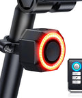 Rad Bike Alarm Tail Light For Happy E-Bike Offroad MTB With Super Loud 110 Decibel Siren And Snazzy Vibration Sensor To Keep Your Ride Safe From Crooks, mounted on black bike seat post with remote