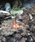 Bombproof Stainless Steel Water Bottle With Hanging Hook For Outdoor Adventures heating over campfire, ideal for cooking