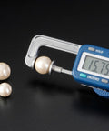 Digital Thickness Gauge 0-25mm measuring a pearl at 15.75mm, Electronic Vernier Caliper for Gemstones and DIY.