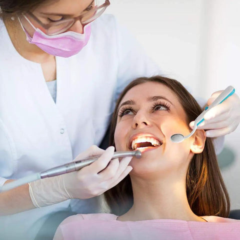 Two Pack LED Lighted Dental Mirrors For Self Check And Oral Care With Anti Fog Curved Angle Design, Dentist Grade Illumination, Easy On Off Button, ABS Handle, Great For Home Dental Exams And Easy Peasy Tooth Inspections. Dentist using an LED dental mirror during a tooth exam.