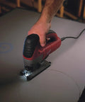 Top Notch 6.2 Amp Orbital Jig Saw Boasting Tool Free Blade Swap And Seven Setting Speed Dial For Sharp Clean Cuts On Any Drywall Or Lumber Gig You Roll With Today in use on a sheet of drywall.