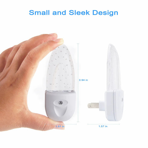 Hand holding a Multicolor LED Night Light from 4 pack with Bubble Pattern and Dusk to Dawn Sensor Rotating Eight Colors Plug In
