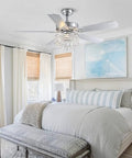 52 Inch Crystal Chandelier Ceiling Fan With Dope Matte Black Finish And Silky Smooth Reversible Blades Featuring A Chill Whisper Quiet Motor Plus Wireless Remote For Bedroom Or Living Room Vibes in a modern bedroom.