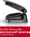 Compact Space Saver Two Serving Grill And Panini Press with open lid showing nonstick surface and fat-removing slope.