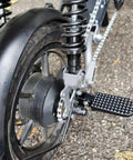 Stylish Foldable E-Bike Rear Footrests In Heavy Duty Aluminum Alloy Black For Passenger Comfort And Stability On Any Commute Or Road Trip Adventure rear footrest on e-bike wheel