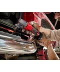 Using 16 Gauge Speed Nibbler For M12 FUEL 12V Cordless Metal Cutter With Starter Kit on vehicle metal sheet.